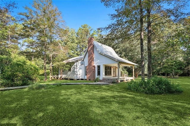 exterior space with a yard and covered porch