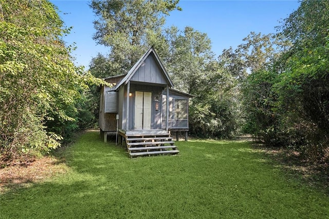 view of outbuilding with a lawn