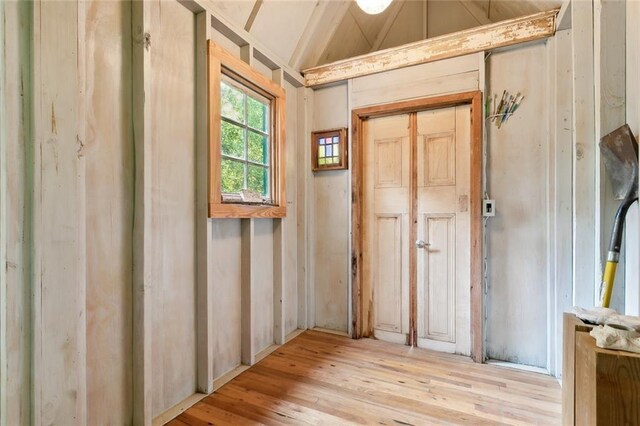 interior space featuring light hardwood / wood-style flooring and vaulted ceiling