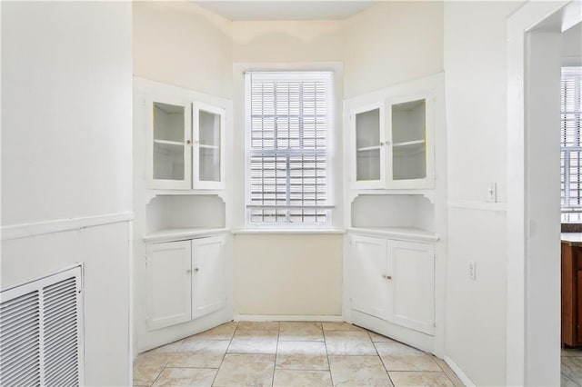 interior space with light tile patterned floors