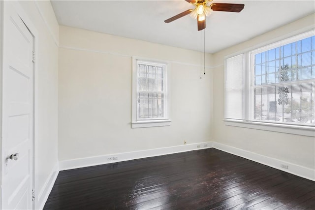 unfurnished room with a healthy amount of sunlight, ceiling fan, and wood-type flooring