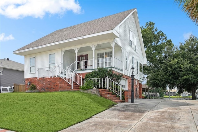 view of front of home featuring covered porch and a front yard