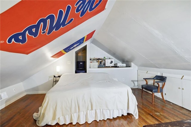 bedroom featuring lofted ceiling and dark wood-type flooring