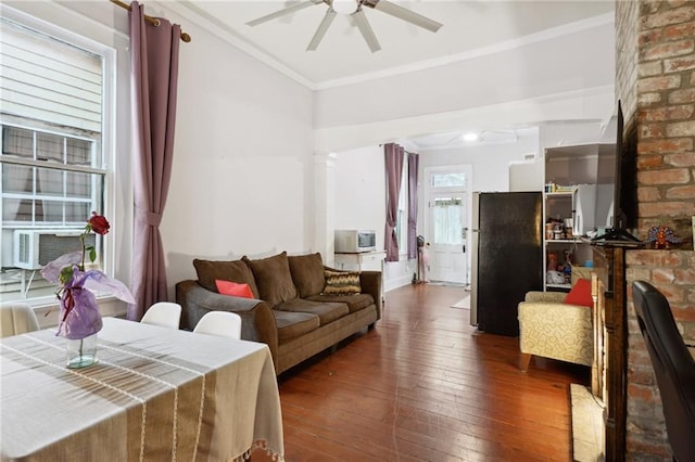 living room with ornamental molding, cooling unit, ceiling fan, and dark hardwood / wood-style floors