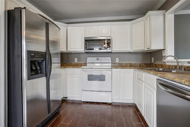 kitchen featuring dark hardwood / wood-style flooring, sink, appliances with stainless steel finishes, and white cabinets