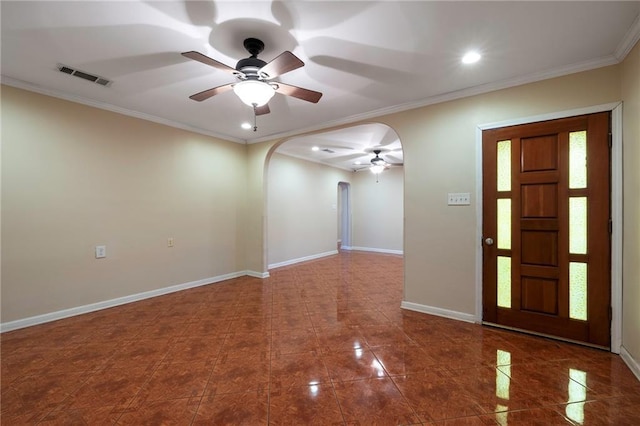 3306 Trafalgar St, New Orleans, LA 70112 - entrance foyer featuring a ceiling fan, crown molding, visible vents, baseboards, and arched walkways