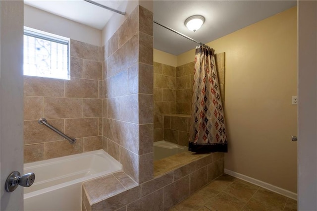 bathroom with tile patterned flooring and shower / bathtub combination with curtain