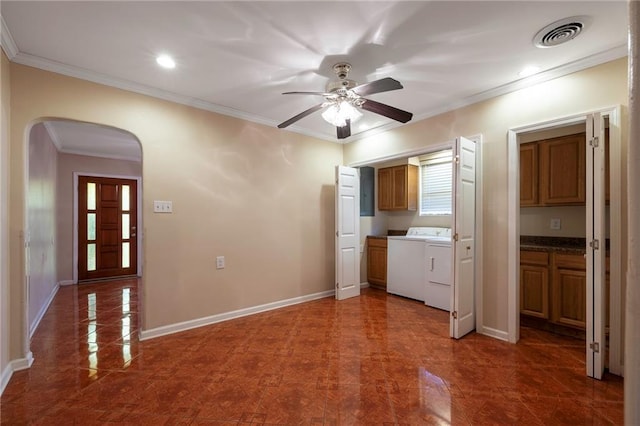 3306 Trafalgar St, New Orleans, LA 70112 - interior space with ornamental molding, visible vents, arched walkways, a ceiling fan, and washing machine and dryer