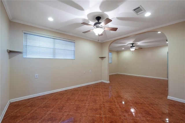 3306 Trafalgar St, New Orleans, LA 70112 - empty room with a ceiling fan, baseboards, visible vents, crown molding, and arched walkways
