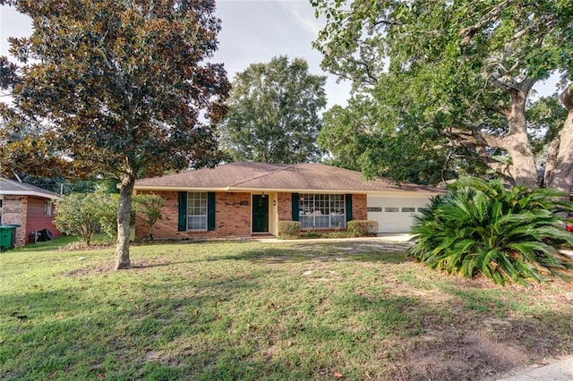 ranch-style home with a garage and a front lawn