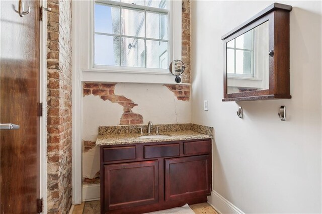 bathroom with vanity and plenty of natural light