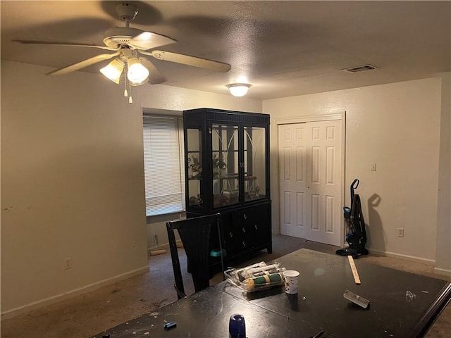 unfurnished dining area featuring ceiling fan