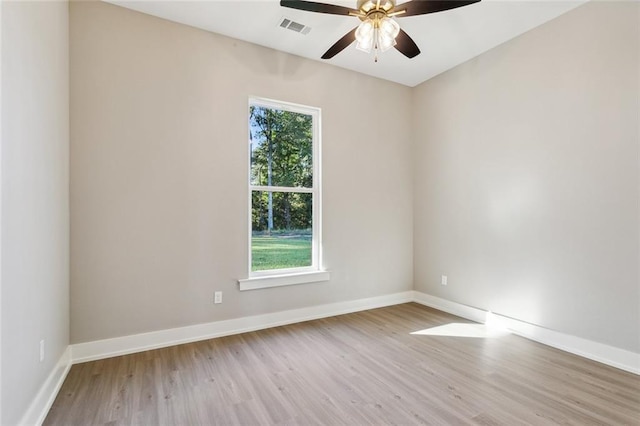 empty room featuring light wood-type flooring and a healthy amount of sunlight