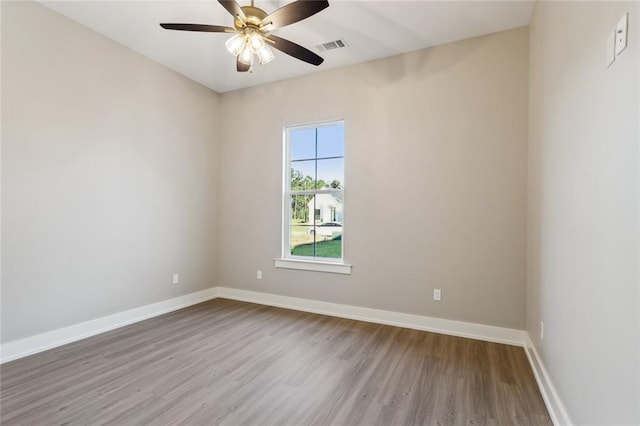 spare room featuring ceiling fan and light hardwood / wood-style flooring