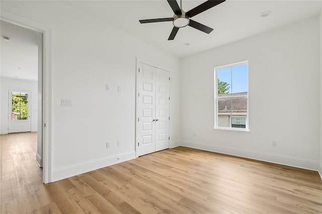 unfurnished bedroom with light hardwood / wood-style flooring and ceiling fan