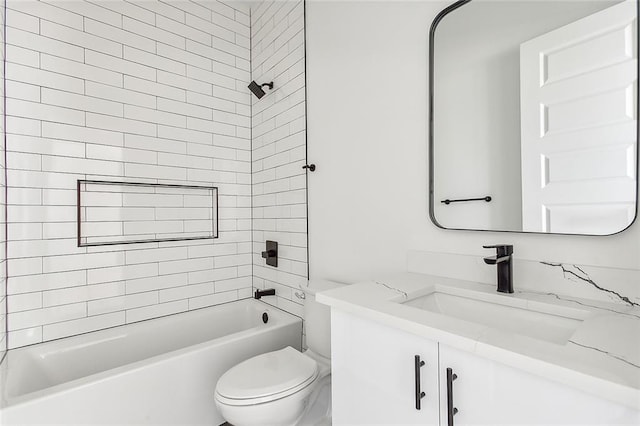 full bathroom featuring vanity, toilet, and tiled shower / bath