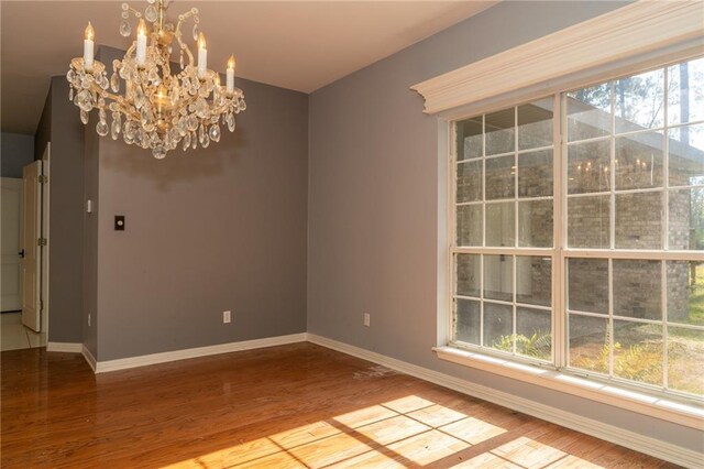 living room featuring a raised ceiling, ceiling fan, hardwood / wood-style flooring, and plenty of natural light