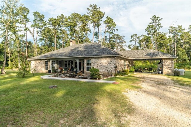 view of home's community with a patio area and a lawn