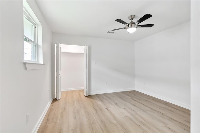 unfurnished room featuring light hardwood / wood-style flooring and ceiling fan