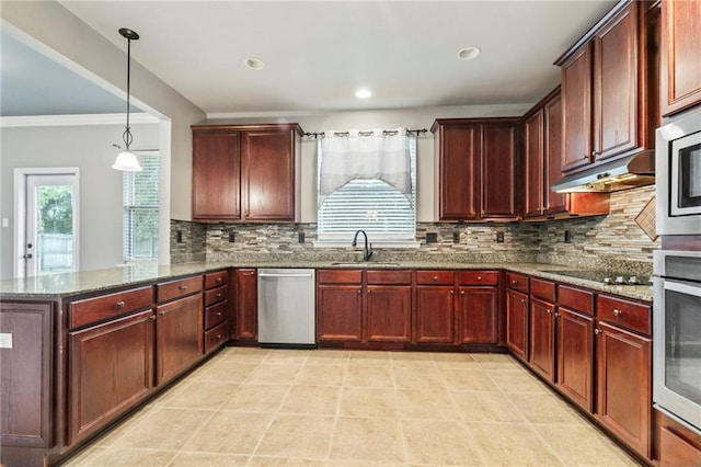 kitchen with stone countertops, appliances with stainless steel finishes, and tasteful backsplash