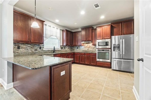 kitchen featuring stainless steel appliances, backsplash, kitchen peninsula, dark stone counters, and decorative light fixtures