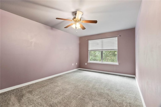 carpeted empty room with ceiling fan