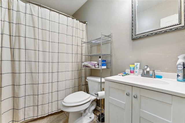 bathroom featuring tile patterned flooring, vanity, toilet, and a shower with shower curtain