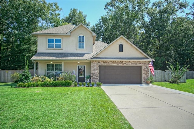 view of front of property featuring a garage and a front yard