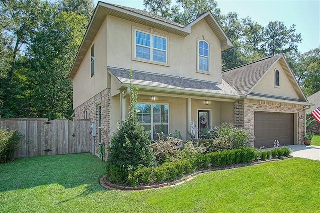 view of front of home featuring a garage and a front yard