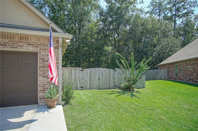 view of yard featuring a garage