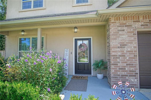 doorway to property with a porch