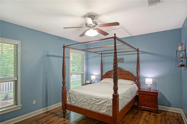 bedroom featuring ceiling fan and dark hardwood / wood-style flooring