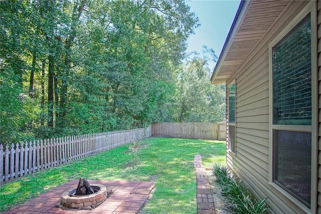 view of yard with an outdoor fire pit