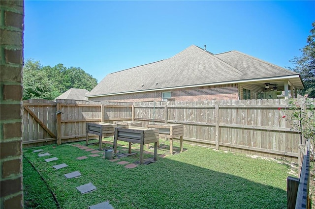 view of yard featuring ceiling fan