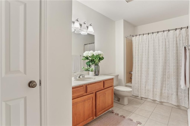 full bathroom featuring tile patterned flooring, vanity, toilet, and shower / tub combo