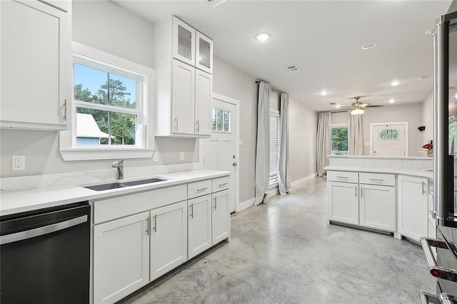 kitchen with a healthy amount of sunlight, ceiling fan, sink, and stainless steel dishwasher