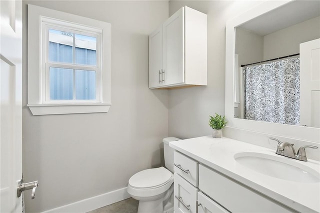 bathroom featuring toilet and vanity