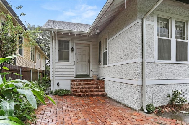 property entrance with a patio area