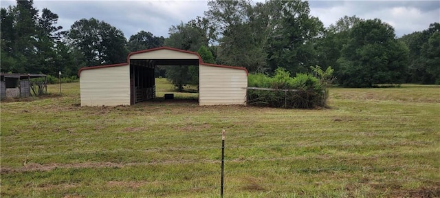 view of outdoor structure featuring a lawn