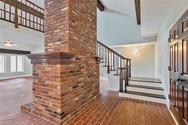 entrance foyer featuring beam ceiling, ceiling fan, and high vaulted ceiling