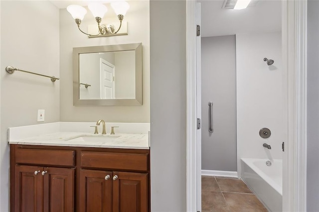 bathroom featuring tile patterned floors, vanity, shower / bath combination, and an inviting chandelier