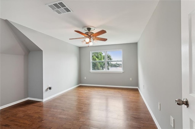 interior space with ceiling fan and dark hardwood / wood-style flooring