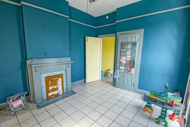 122729 Carondelet St, New Orleans, LA 70130 - unfurnished living room with tile patterned flooring and a fireplace with flush hearth