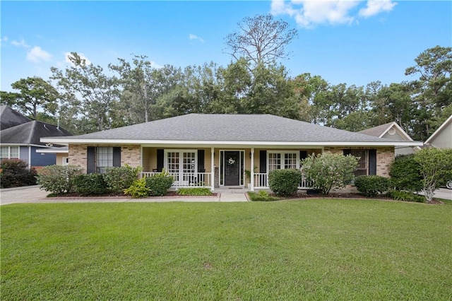 single story home featuring a front lawn and covered porch