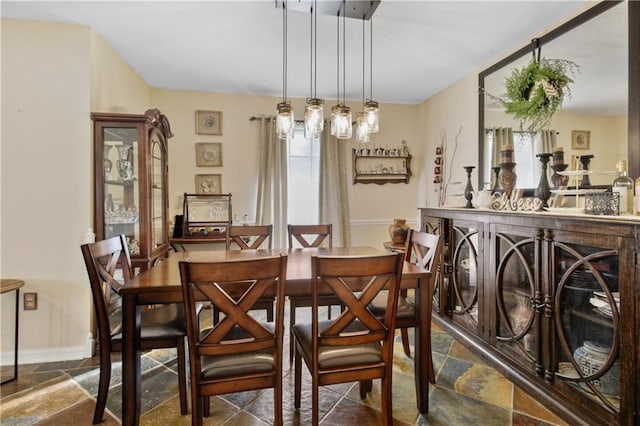 dining room featuring a wealth of natural light and a chandelier