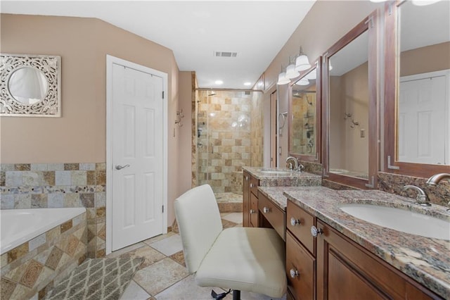 bathroom featuring vanity, tile patterned floors, and plus walk in shower