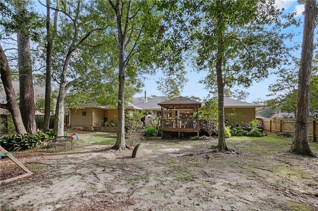 view of yard with a wooden deck and a gazebo