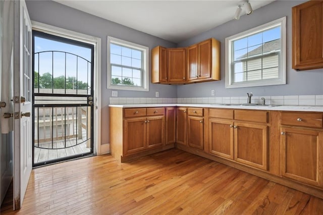 kitchen featuring light hardwood / wood-style flooring and sink