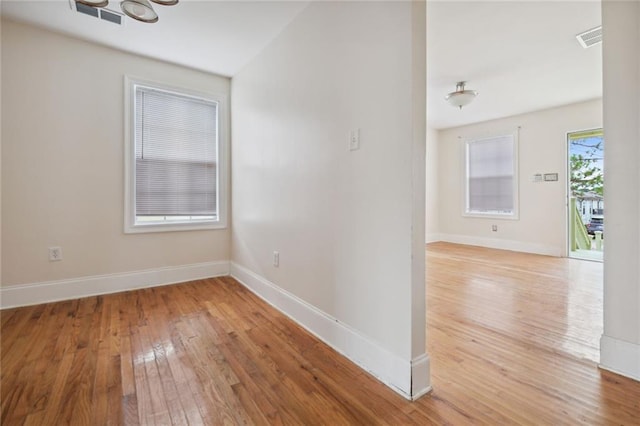 spare room with light hardwood / wood-style floors