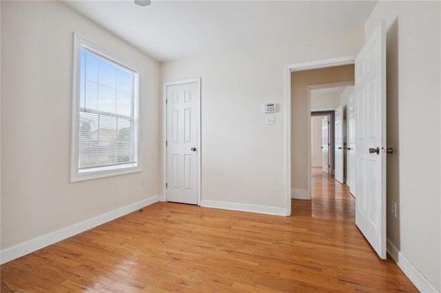 unfurnished room featuring light hardwood / wood-style flooring